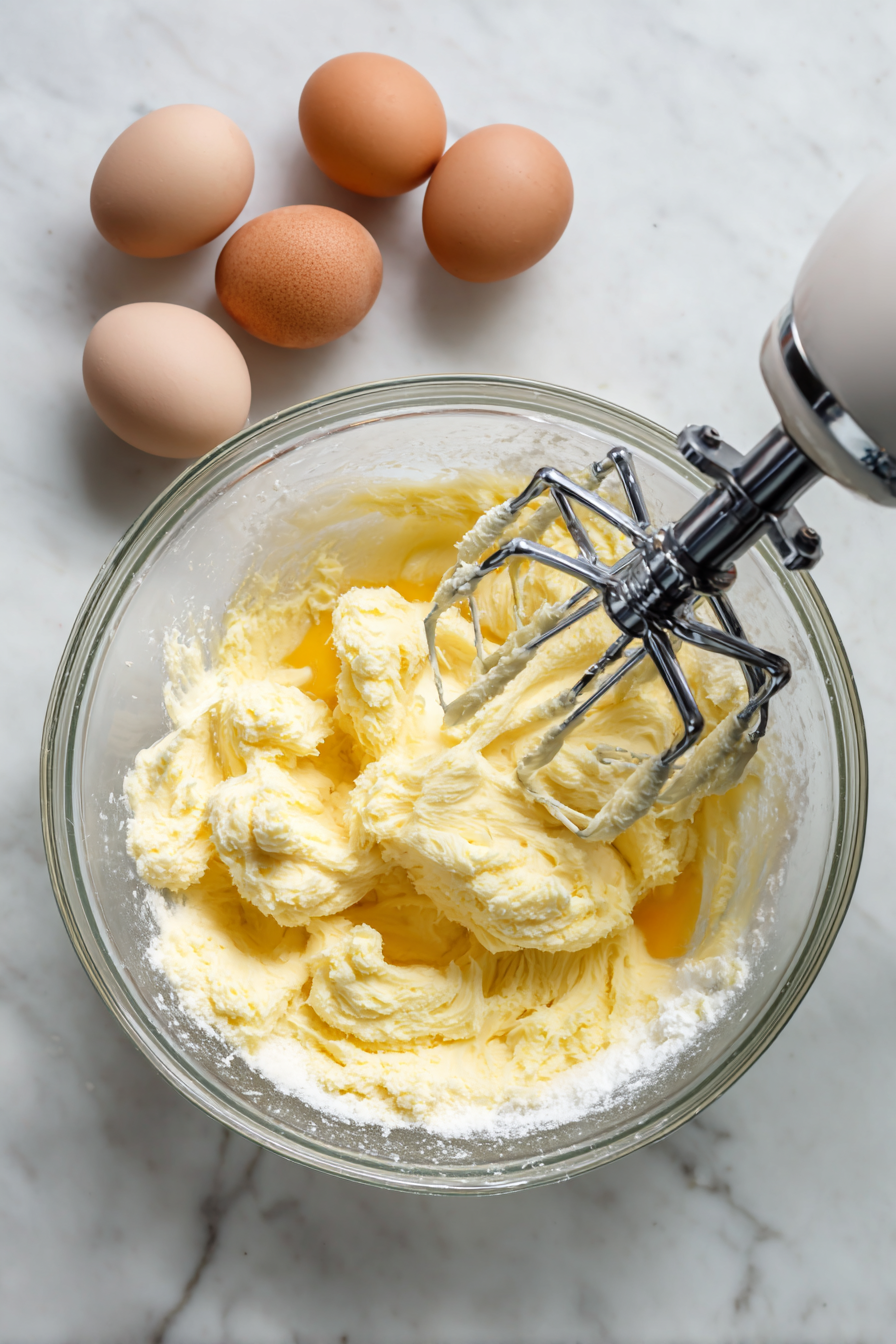 In a large bowl, cream together butter and sugar until light and fluffy. Add eggs and vanilla, beating well.