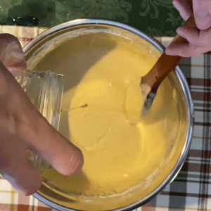 The image shows the process of making batter for smith island cake