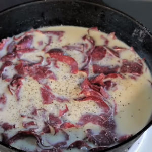 the image shows the process of making creamy sauce for Shit on A Shingle Recipe