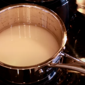 The image shows the process of makingbsigar syrup for french buttercream recipe