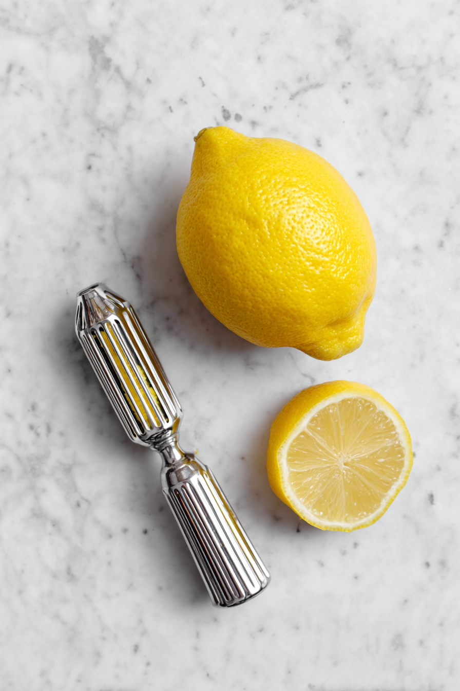 Prepare Lemon Zest: Peel off a strip of lemon zest using a vegetable peeler or channel knife.