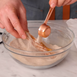 This image shows Mixture of sugar and cinnamon for churros