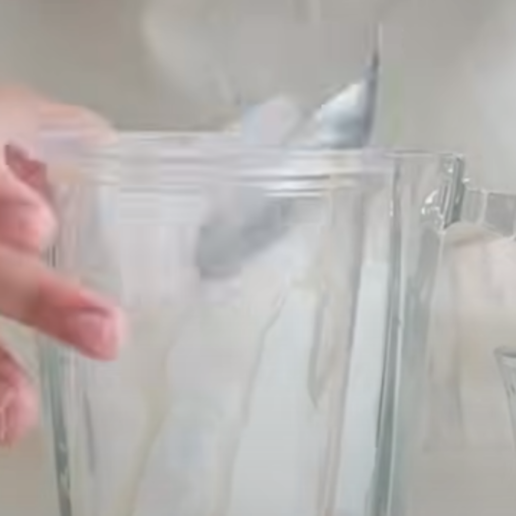 This image shows adding ice to the glass.