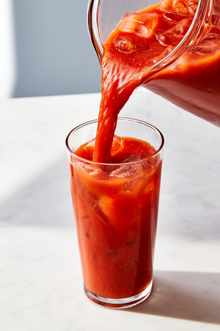 Pour 6 ounces of Bloody Mary mix into each glass