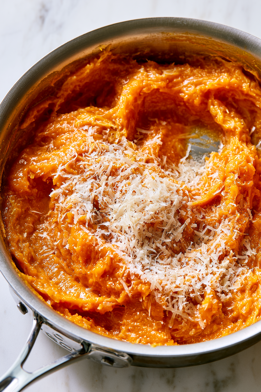 Brown 6 tablespoons of butter in a sauté pan, then blend with pumpkin, spices, vinegar, and cane syrup. Fold in Parmesan and cool