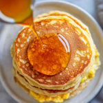 McGriddle sandwiches served on an elegant plate, showcasing the warm, golden-brown pancakes and melted cheese.