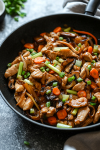 the image shows adding the marinated chicken into saute vegetables