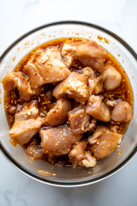 the image shows the Marinate the chicken in the sake sauce