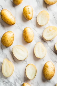 the image shows the potatoes is being cut into half