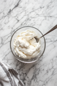 the image shows whipping up labneh until it become smooth