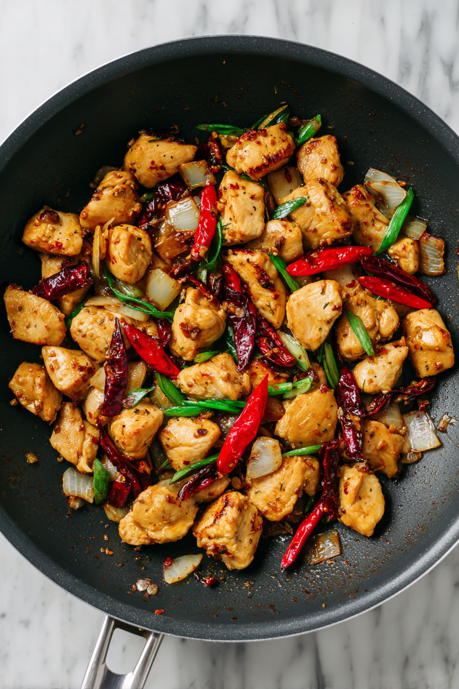 Add chicken pieces and cook until they start to brown.