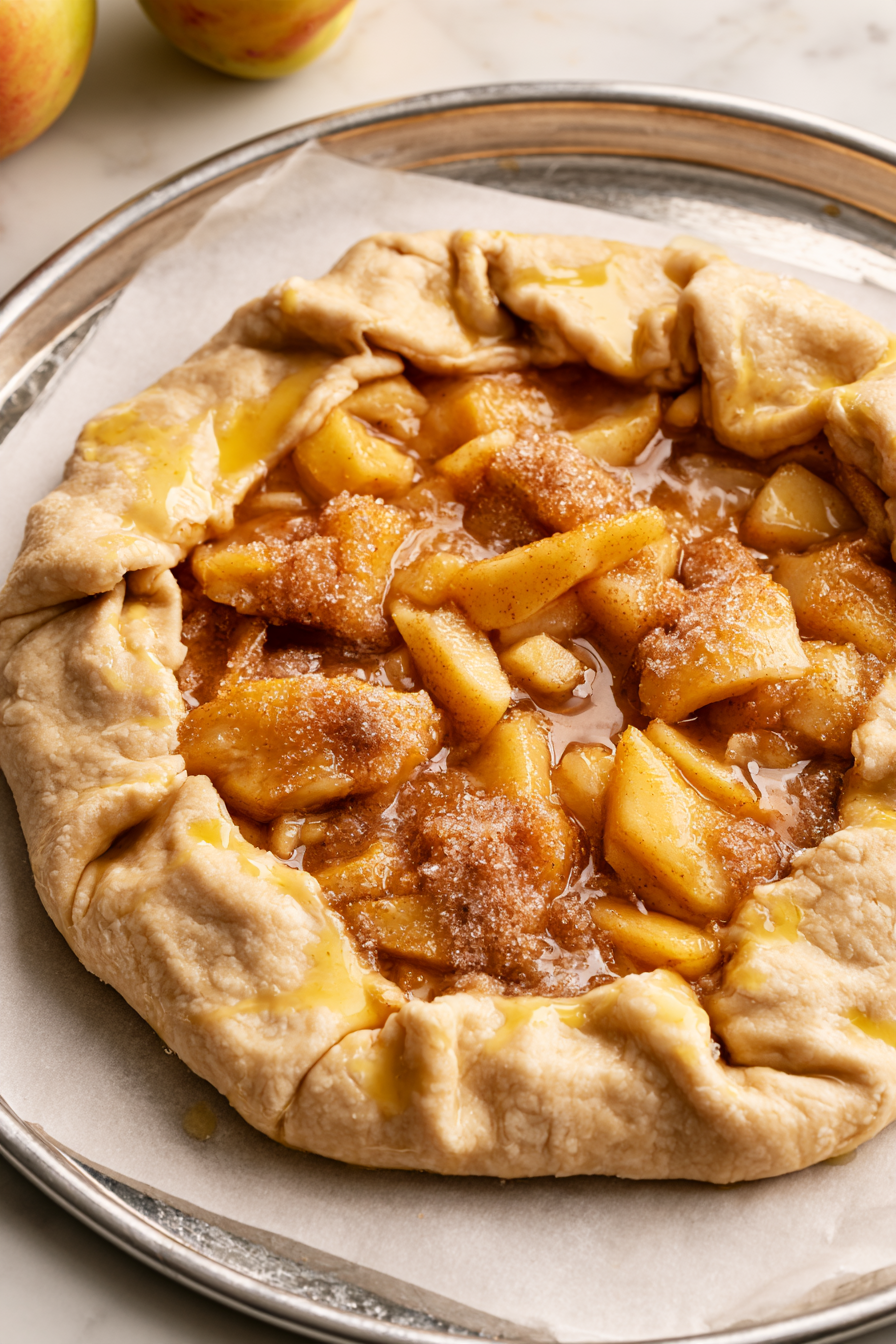 Brush edges with egg wash, sprinkle with sugar, and refrigerate for 15–20 minutes