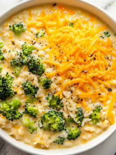 A beautifully served dish of creamy broccoli cheddar rice casserole, highlighting its cheesy and creamy texture, part of the Creamy Broccoli Cheddar Rice Recipe.