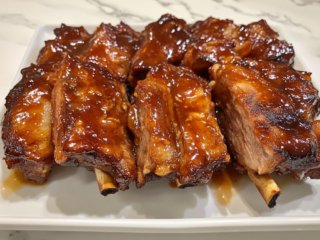 Easy Pork Ribs With Peach & Molasses Glaze is ready to serve