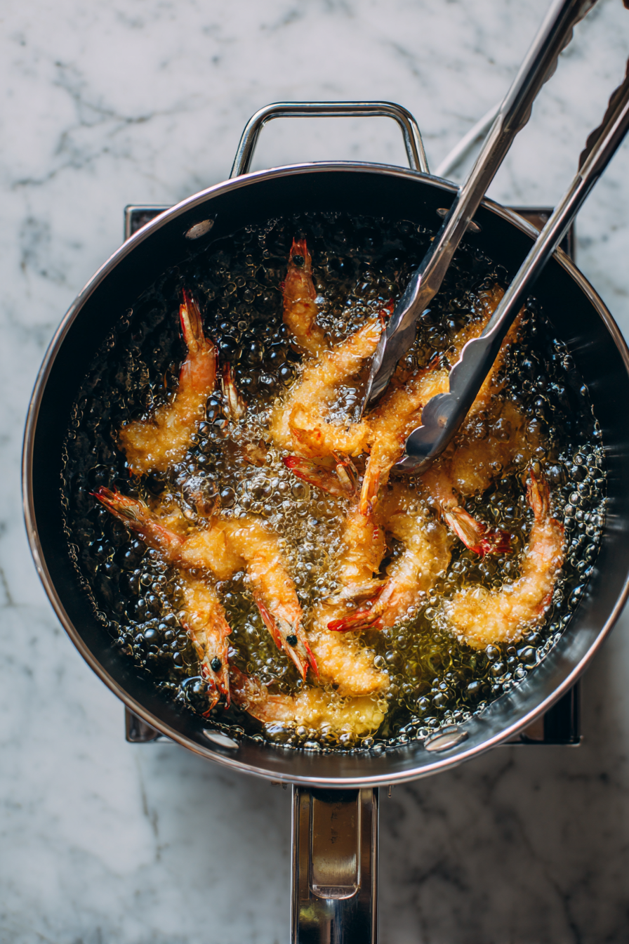 Fry them till golden brown. That means they're done and ready to eat.