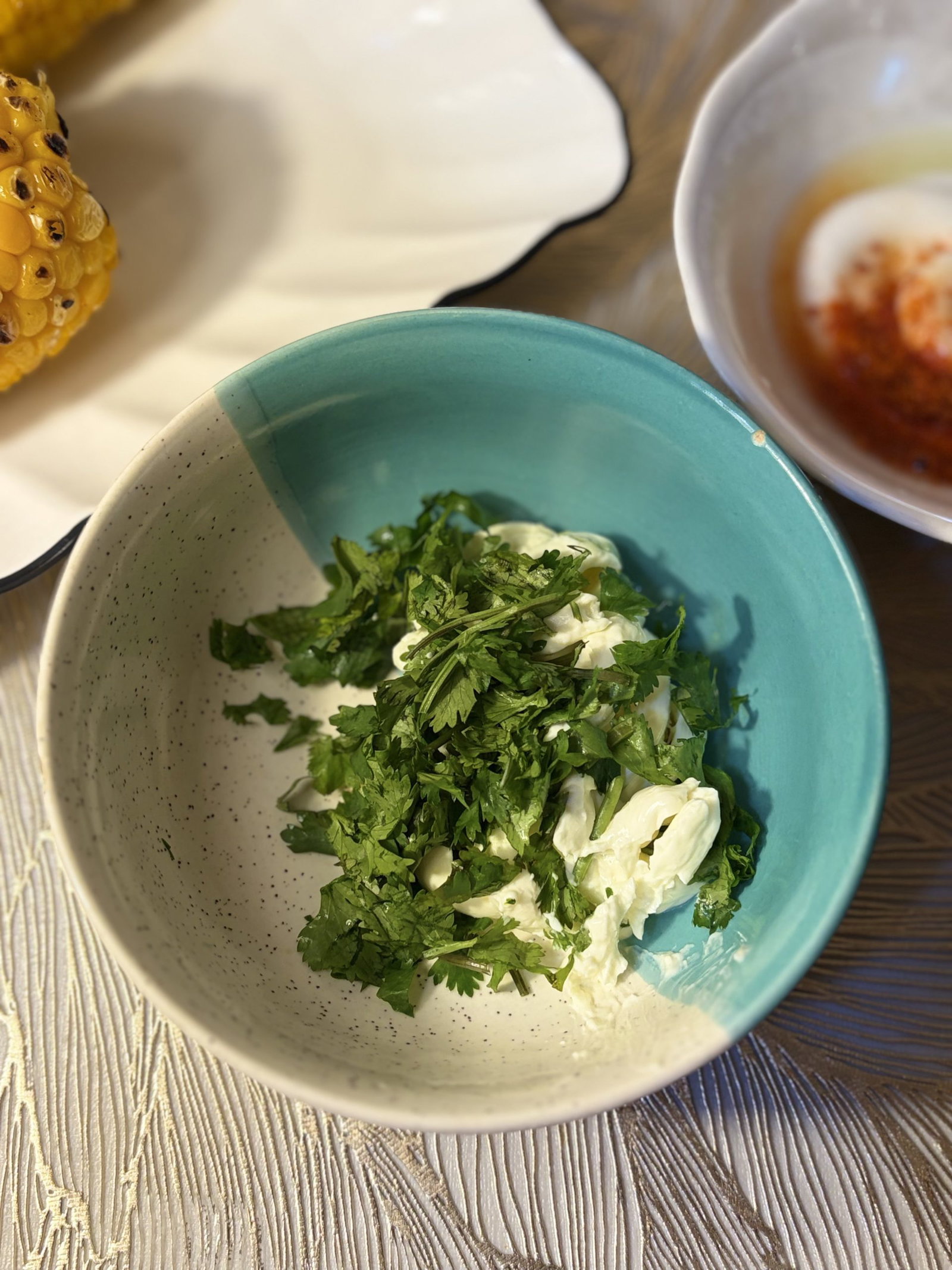 In another bowl, stir together the Cotija cheese and chopped cilantro and set both aside.