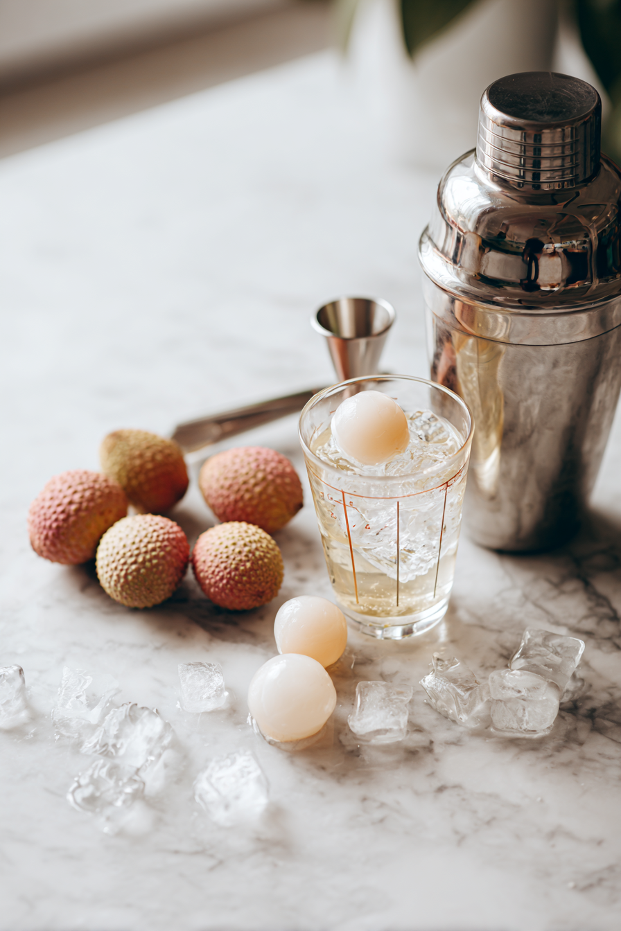 Measure 2 ½ ounces of vodka, 2 ounces of orange liqueur, and 2 ounces of lychee