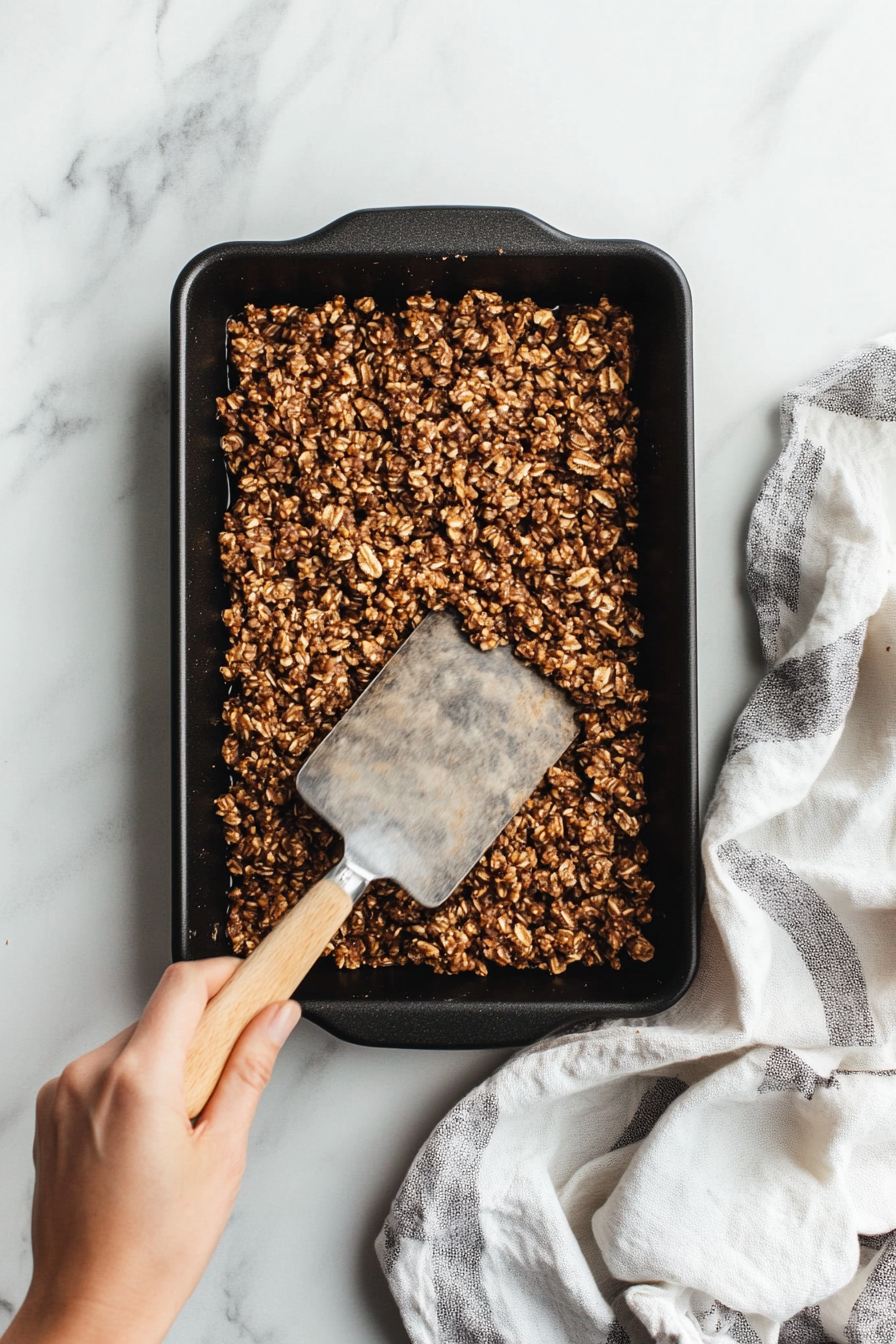 Press the mixture into a pan or mold and allow it to cool and solidify.