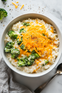 A serving of creamy broccoli cheddar rice plated and ready to enjoy, showcasing the final presentation of the Creamy Broccoli Cheddar Rice Recipe.