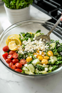 Crumbling feta and spooning beans over radicchio salad base