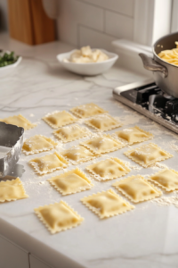 Assembling pumpkin ravioli with pumpkin ricotta filling on pasta sheets