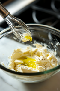 Beating Cream Cheese and Olive Oil for Spider Cheese Balls