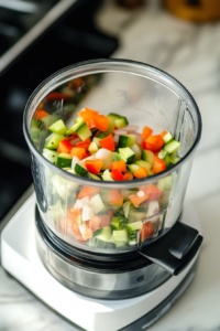 Blending Vegetables with Tomatoes and Seasonings for Sausage Fingers Pasta