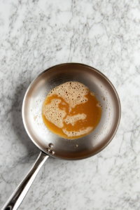 Butter and sugar melting in a skillet