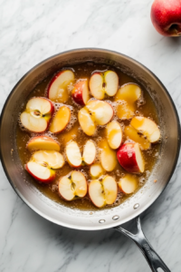 Caramelizing apples in amber sauce