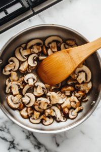 Cooking shiitake mushrooms for Dumpling Soup recipe until softened