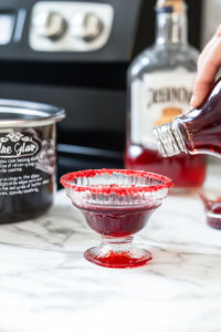 Creating Spooky Drip Effect with Red Corn Syrup on Glass Rims for Halloween Punch