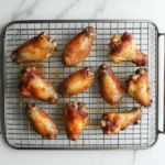Crispy baked chicken wings ready to serve after cooling