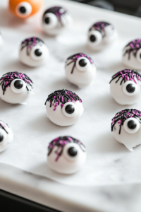 Decorating Candy-Coated Donuts with Candy Eyeballs and Sprinkles