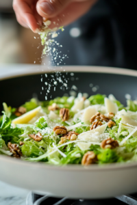 Fennel walnut salad topped with remaining walnuts Parmesan and a sprinkle of fennel fronds with lemon zest for added texture and flavor