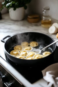 Fresh Butternut Squash Ravioli Cooking in a Pot of Boiling Water