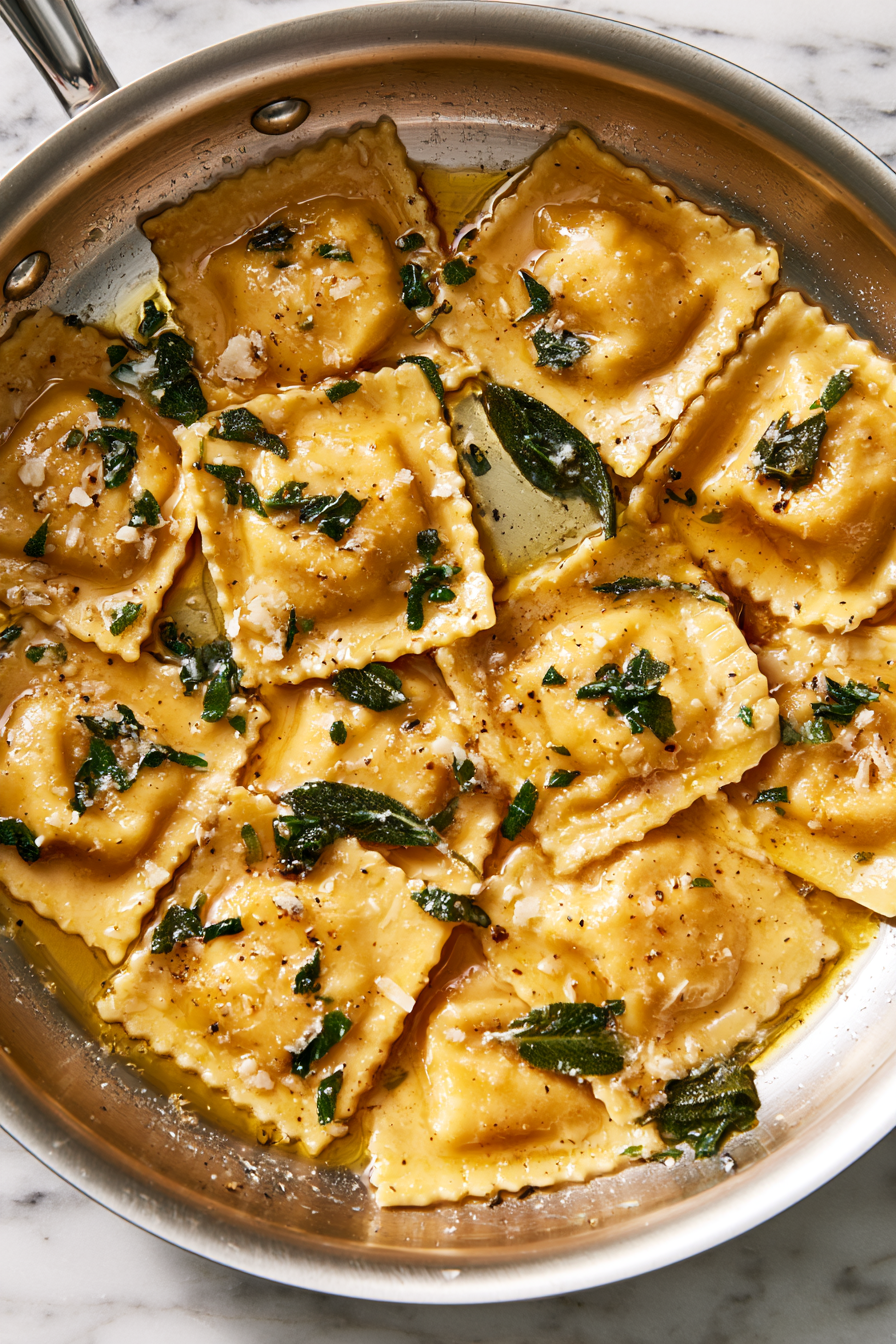 Gently toss the cooked ravioli in the sage butter sauce to coat evenly