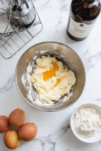 Mixing the Apple-Rum Spice Cake batter with chopped apples