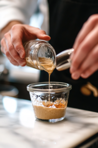 Preparing maple tahini dressing with tahini, lemon juice, maple syrup, garlic, and spices