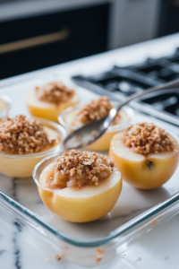 Stirring oats and add-ins into Classic Baked Apples filling mixture