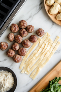 Unwrapping Crescent Dough and Cutting Into Strips for Mummy Meatballs