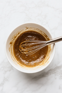 Whisking Wet Ingredients for Baked Apple Cider Doughnuts