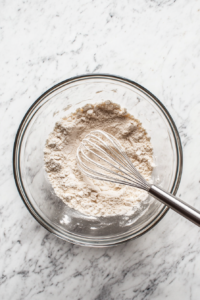 Whisking dry ingredients for Apple Cider Cream Pie crust