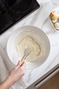 Whisking yeast mixture for cinnamon-apple babka dough preparation