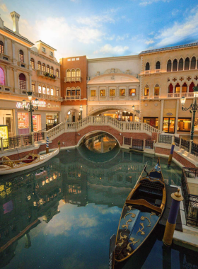 Romantic gondola ride on the Venetian canals in Las Vegas, offering an authentic Venetian experience with gondoliers navigating scenic waterways.