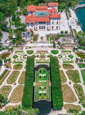 Elegant view of Vizcaya Museum and Gardens, highlighting its historic architecture and beautifully landscaped gardens, reflecting the artistic heritage and natural beauty of Miami.

