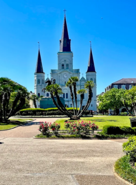 Charming view of Jackson Square in New Orleans, featuring historic buildings, artists displaying their work, and lush greenery, showcasing the lively atmosphere of this popular landmark.