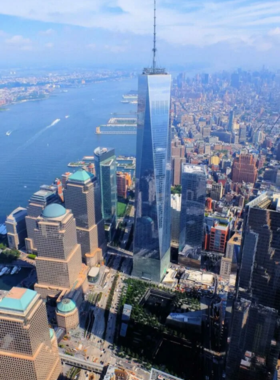 Stunning view of the One World Observatory in New York City, located atop the Freedom Tower, offering panoramic views of Manhattan and symbolizing resilience and innovation.