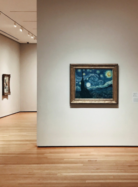 Vincent van Gogh’s “Starry Night” displayed at the Museum of Modern Art (MoMA) in New York City, capturing the swirling night sky and luminous stars in this iconic artwork.

