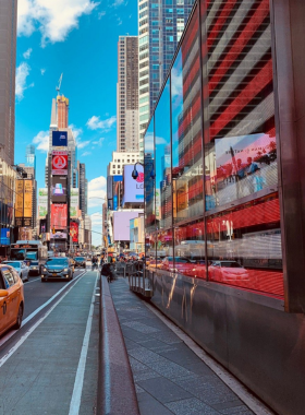 Vibrant view of Times Square in New York City, showcasing the dazzling lights, large billboards, and iconic energy of this famous intersection.