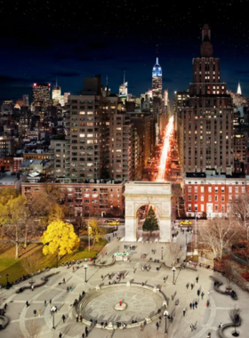 Festive scene at Washington Square Park, New York City, with a decorated Christmas tree beneath the park’s iconic arch, celebrating holiday traditions.